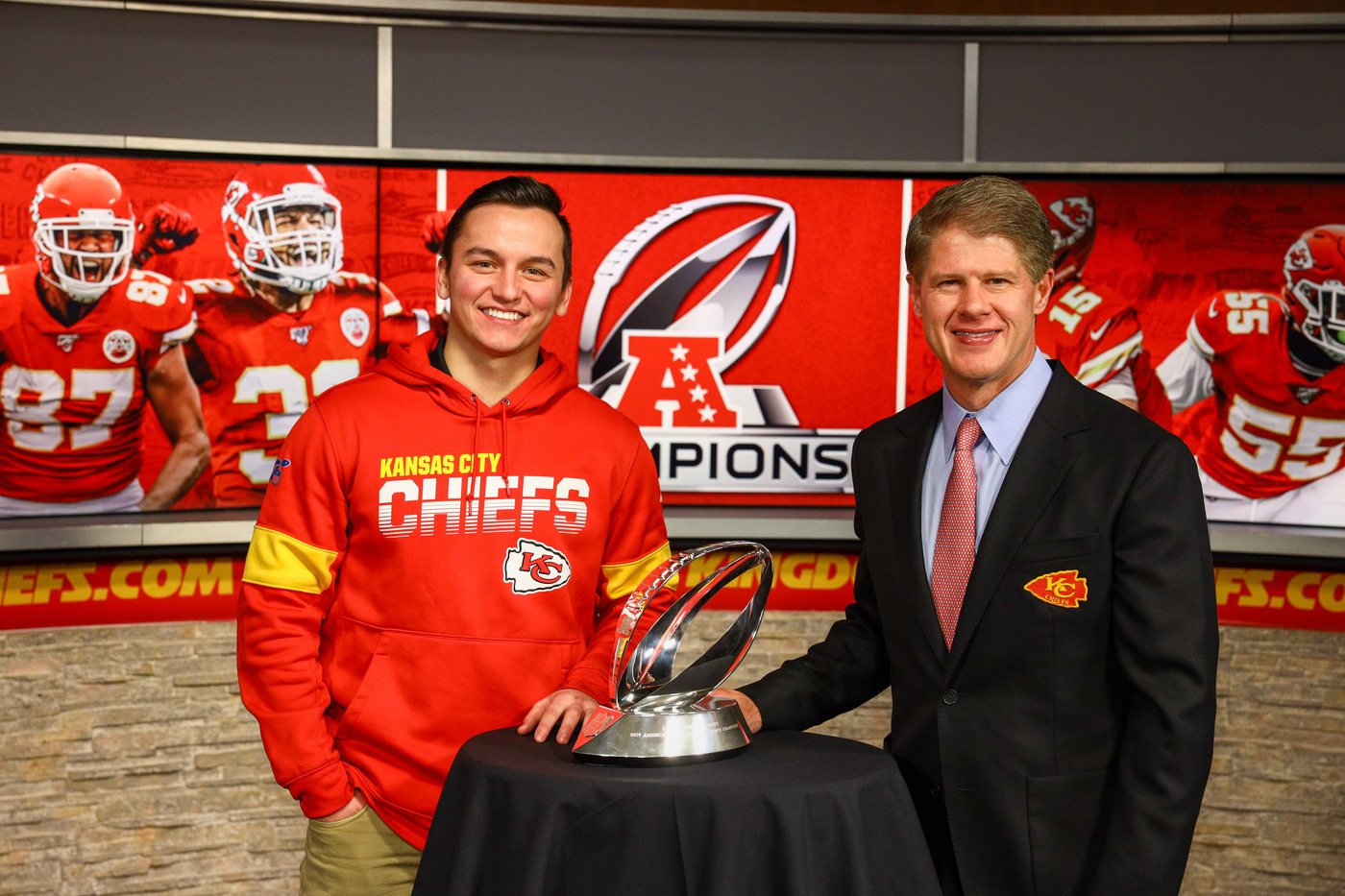 Duncan Boone with the Chiefs' AFC Championship trophy and team chairman Clark Hunt